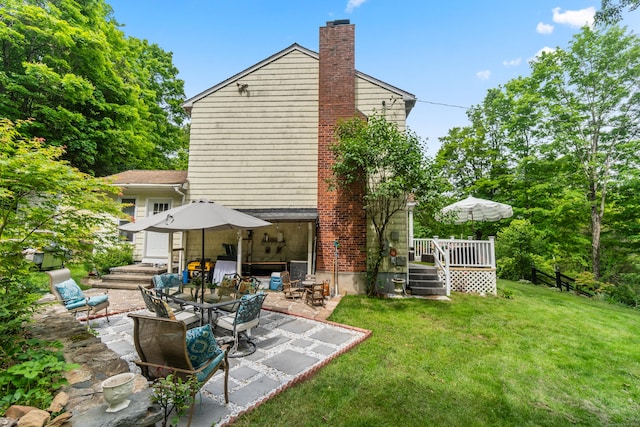30 Hi Barlow Rd, Newtown, CT 06470 - rear view of house with a patio area, a lawn, a wooden deck, and a chimney