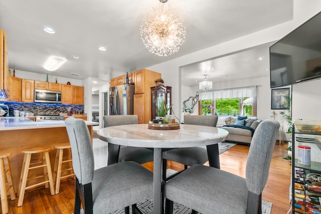 30 Hi Barlow Rd, Newtown, CT 06470 - dining area with a chandelier, light wood-style flooring, and recessed lighting