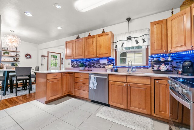 30 Hi Barlow Rd, Newtown, CT 06470 - kitchen featuring appliances with stainless steel finishes, a peninsula, tasteful backsplash, a chandelier, and light countertops
