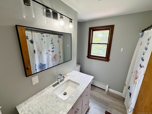 83 Shingle Mill Rd, Harwinton, CT 06791 - bathroom with a baseboard radiator, vanity, wood finished floors, and a shower with shower curtain
