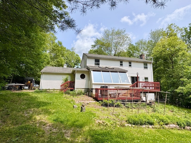 83 Shingle Mill Rd, Harwinton, CT 06791 - rear view of property featuring a chimney, a deck, a yard, and a sunroom