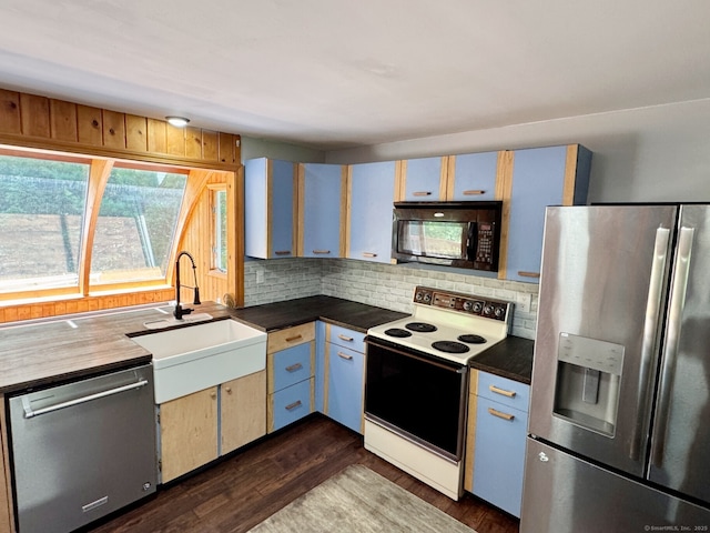 83 Shingle Mill Rd, Harwinton, CT 06791 - kitchen featuring appliances with stainless steel finishes, decorative backsplash, dark countertops, and dark wood finished floors