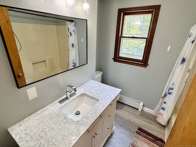 83 Shingle Mill Rd, Harwinton, CT 06791 - full bath featuring a baseboard heating unit, wood finished floors, vanity, and a shower with shower curtain