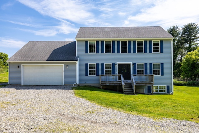 25 Cotton Bridge Rd, Killingly, CT 06241 - colonial inspired home featuring a front lawn, a garage, a wooden deck, and driveway