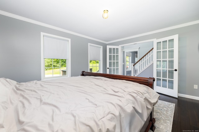 25 Cotton Bridge Rd, Killingly, CT 06241 - bedroom with crown molding, dark wood finished floors, baseboards, and french doors
