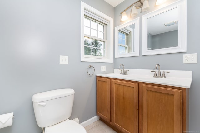 25 Cotton Bridge Rd, Killingly, CT 06241 - bathroom featuring toilet, double vanity, baseboards, and tile patterned flooring