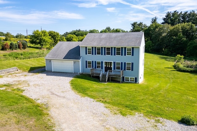 25 Cotton Bridge Rd, Killingly, CT 06241 - colonial-style house featuring gravel driveway, a garage, a front yard, and roof with shingles