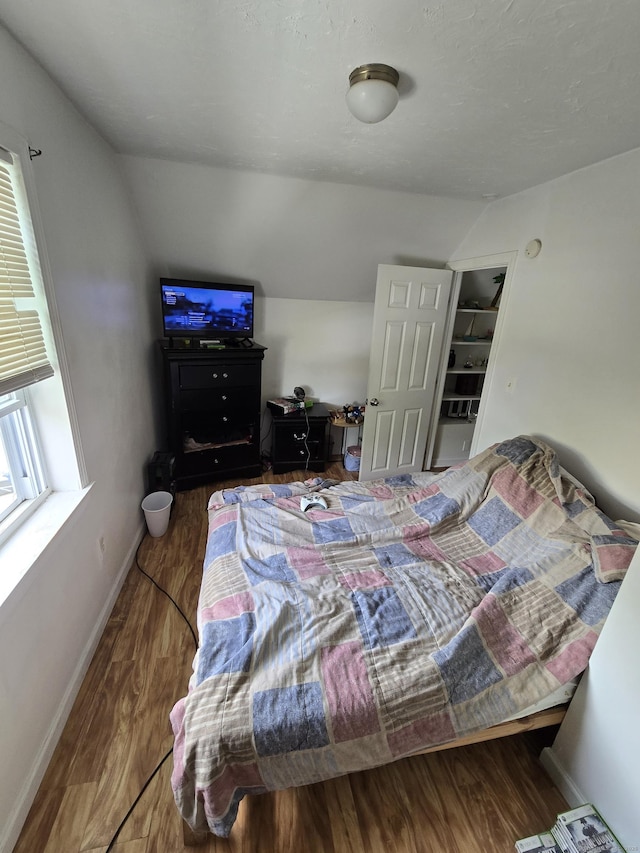 54 Lombard St, New Haven, CT 06513 - bedroom with lofted ceiling, wood finished floors, and baseboards