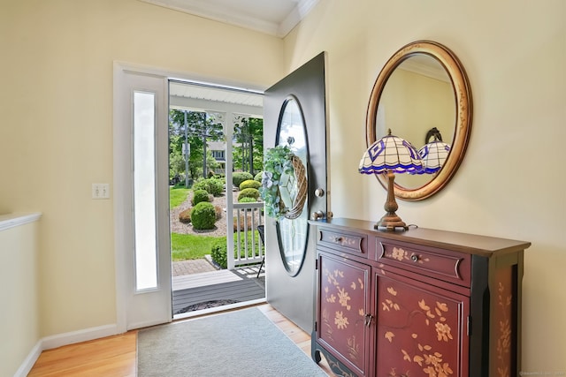 227 Meadow St, Shelton, CT 06484 - foyer featuring light wood-type flooring, crown molding, and baseboards
