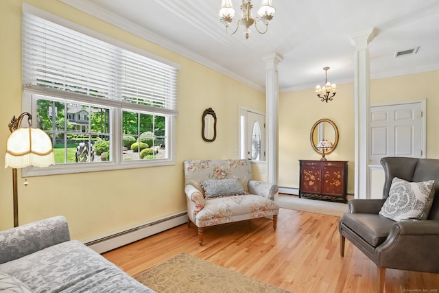 227 Meadow St, Shelton, CT 06484 - living area with ornate columns, a chandelier, a baseboard heating unit, ornamental molding, and wood finished floors