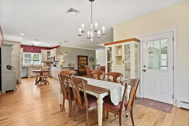227 Meadow St, Shelton, CT 06484 - dining space featuring light wood-style flooring, a chandelier, a baseboard heating unit, crown molding, and recessed lighting