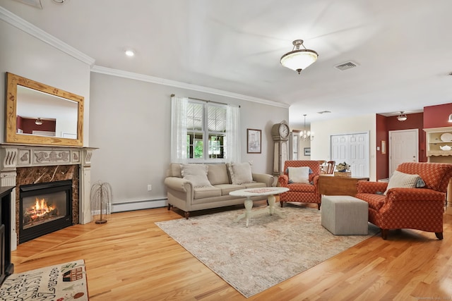 227 Meadow St, Shelton, CT 06484 - living room featuring a baseboard radiator, wood finished floors, ornamental molding, a chandelier, and a fireplace