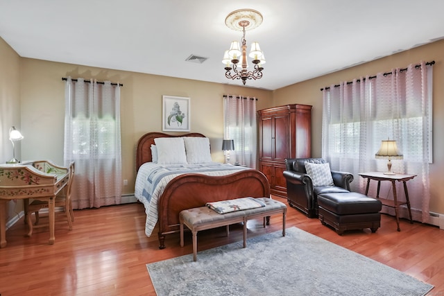 227 Meadow St, Shelton, CT 06484 - bedroom featuring a chandelier and light wood-style flooring