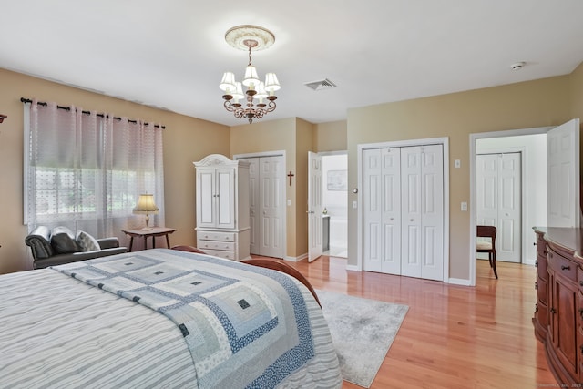 227 Meadow St, Shelton, CT 06484 - bedroom with a chandelier, two closets, light wood finished floors, and baseboards