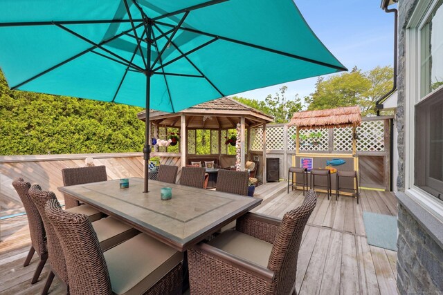 1 Spinnaker Rd, Waterford, CT 06385 - wooden deck with outdoor dining space and a gazebo