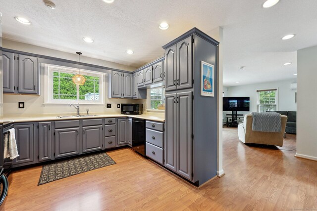 1 Spinnaker Rd, Waterford, CT 06385 - kitchen featuring gray cabinetry, black appliances, a sink, light wood finished floors, and recessed lighting