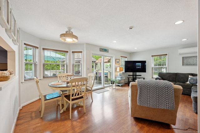 1 Spinnaker Rd, Waterford, CT 06385 - dining space with a wall mounted AC, wood finished floors, recessed lighting, and baseboards