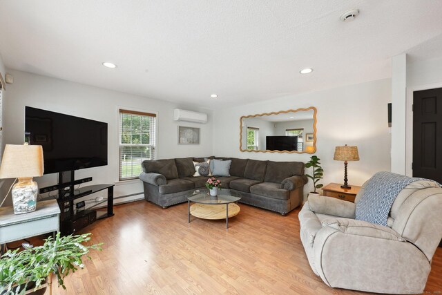 1 Spinnaker Rd, Waterford, CT 06385 - living area featuring a wall unit AC, light wood-style flooring, and recessed lighting