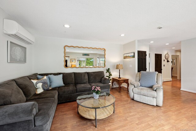 1 Spinnaker Rd, Waterford, CT 06385 - living area featuring a wall mounted AC, light wood-style flooring, and recessed lighting