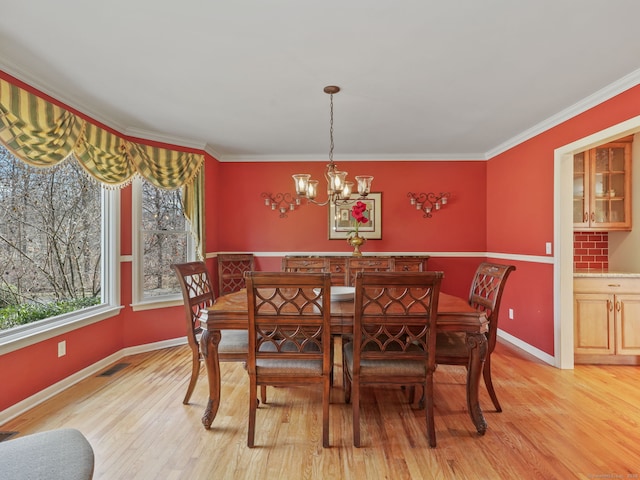235 Lonetown Rd, Redding, CT 06896 - dining area featuring a chandelier, light wood-type flooring, baseboards, and ornamental molding
