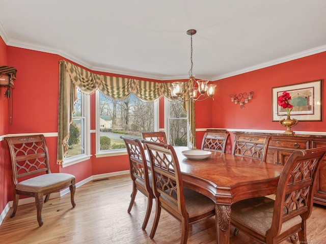 235 Lonetown Rd, Redding, CT 06896 - dining space featuring a chandelier, crown molding, light wood-type flooring, and baseboards