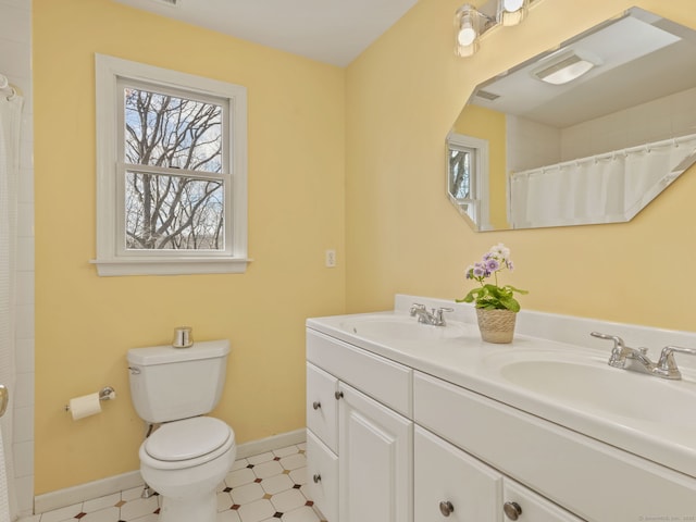 235 Lonetown Rd, Redding, CT 06896 - bathroom featuring double vanity, toilet, baseboards, a shower with curtain, and tile patterned floors
