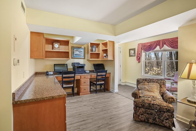 235 Lonetown Rd, Redding, CT 06896 - home office featuring built in desk, light wood-type flooring, and baseboards