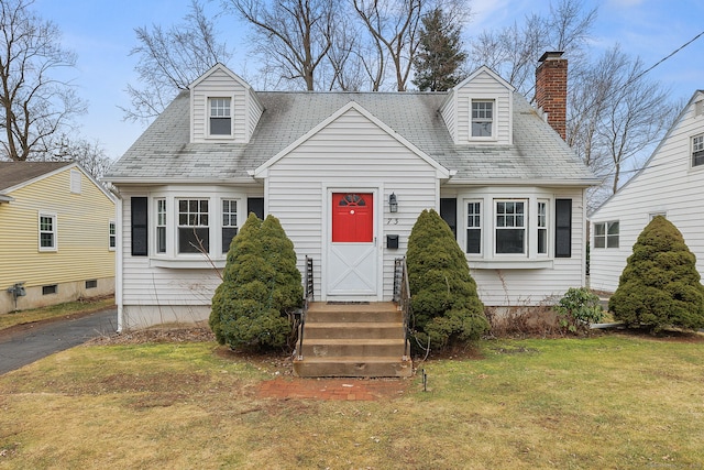 73 Camp Ave, Newington, CT 06111 - cape cod home featuring a front lawn and a chimney