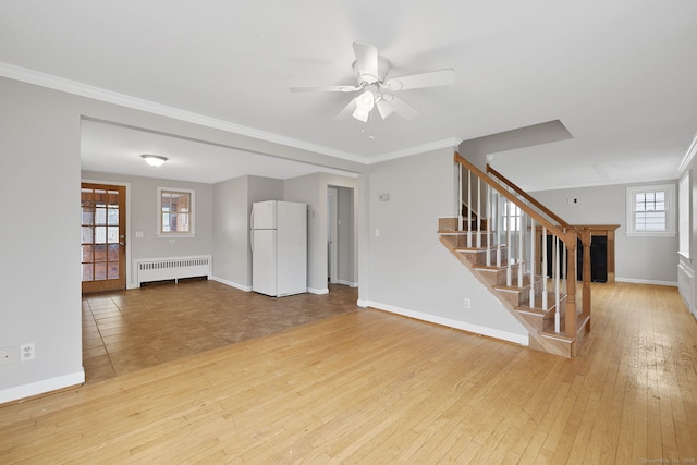 73 Camp Ave, Newington, CT 06111 - unfurnished living room featuring radiator heating unit, stairway, hardwood / wood-style flooring, a ceiling fan, and crown molding