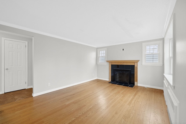 73 Camp Ave, Newington, CT 06111 - unfurnished living room featuring ornamental molding, light wood finished floors, and a tile fireplace