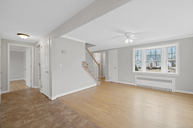 73 Camp Ave, Newington, CT 06111 - unfurnished living room with radiator, stairs, a ceiling fan, and crown molding