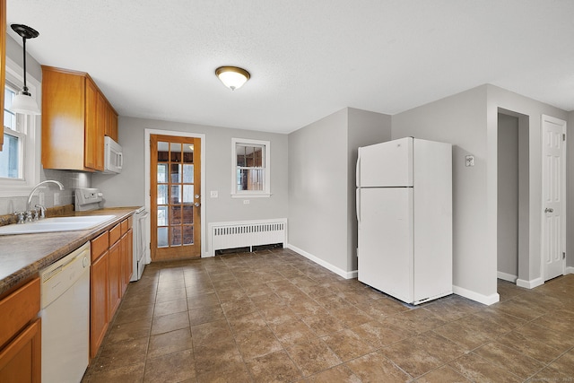 73 Camp Ave, Newington, CT 06111 - kitchen featuring white appliances, radiator, brown cabinetry, decorative light fixtures, and a textured ceiling