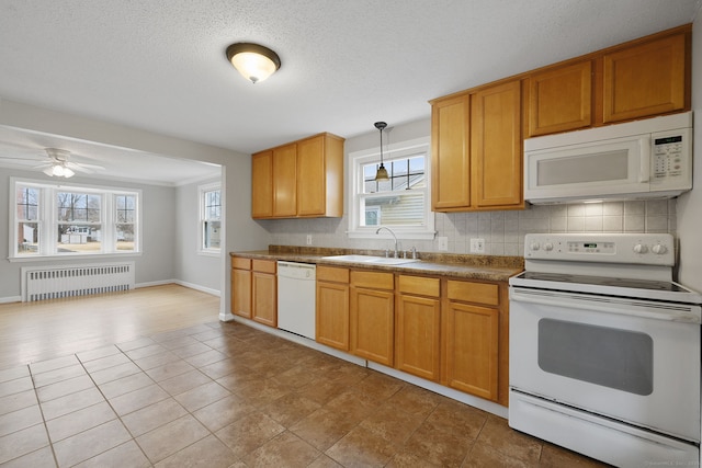 73 Camp Ave, Newington, CT 06111 - kitchen with white appliances, radiator heating unit, decorative backsplash, and plenty of natural light