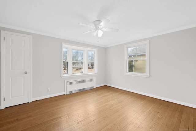 73 Camp Ave, Newington, CT 06111 - spare room featuring radiator heating unit, ceiling fan, hardwood / wood-style floors, ornamental molding, and plenty of natural light