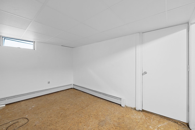 73 Camp Ave, Newington, CT 06111 - basement with baseboard heating and a paneled ceiling