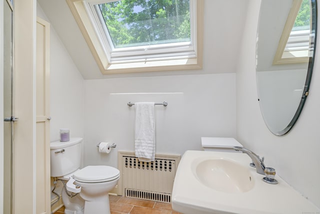 77 Crest Rd, Middlebury, CT 06762 - bathroom with radiator heating unit, plenty of natural light, toilet, and a skylight