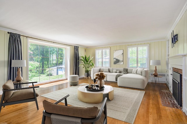77 Crest Rd, Middlebury, CT 06762 - living room with ornamental molding, a fireplace, and wood finished floors