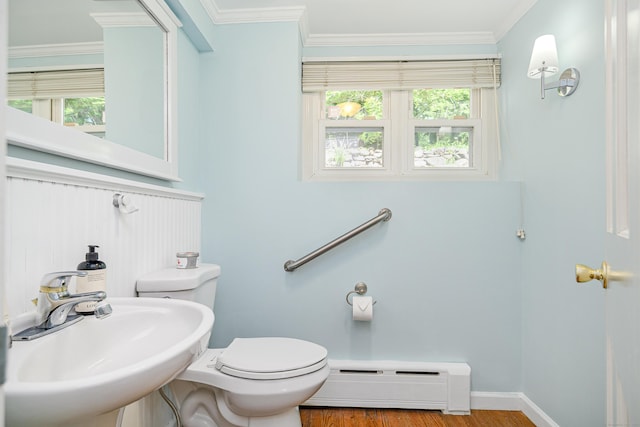 77 Crest Rd, Middlebury, CT 06762 - bathroom with baseboard heating, a sink, toilet, wood finished floors, and crown molding