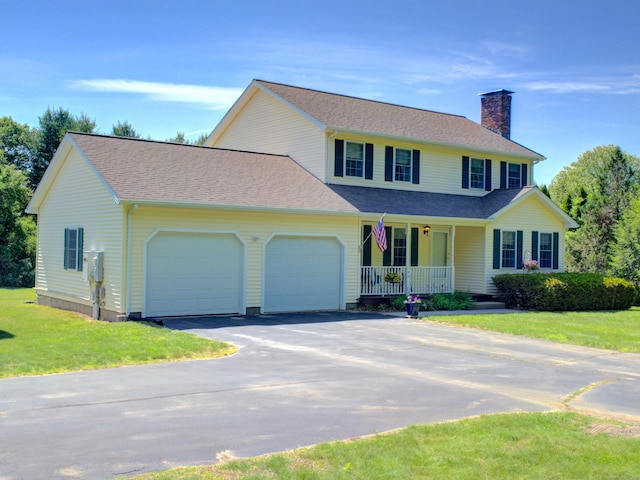 193 Pickett Rd, Plainfield, CT 06374 - view of front facade with a porch, an attached garage, a chimney, asphalt driveway, and a front lawn