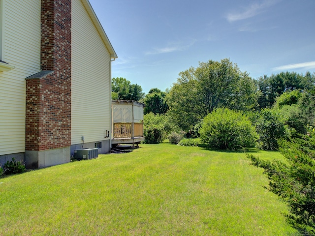 193 Pickett Rd, Plainfield, CT 06374 - view of green lawn featuring cooling unit and a deck