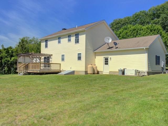 193 Pickett Rd, Plainfield, CT 06374 - back of property with a pergola, a lawn, and a wooden deck