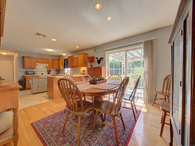 193 Pickett Rd, Plainfield, CT 06374 - dining area featuring recessed lighting, light wood-style floors, and a textured ceiling