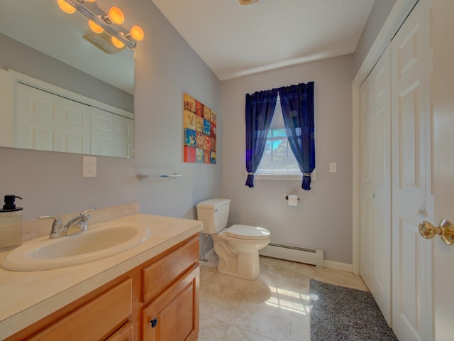 193 Pickett Rd, Plainfield, CT 06374 - bathroom with a baseboard radiator, a closet, vanity, tile patterned flooring, and toilet