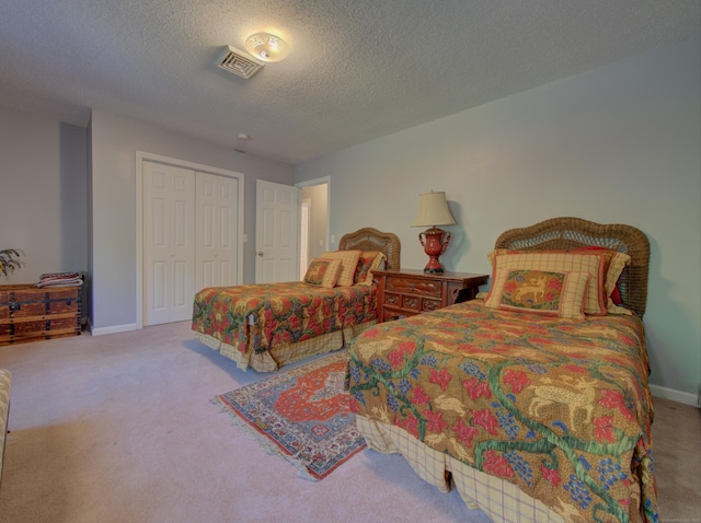 193 Pickett Rd, Plainfield, CT 06374 - bedroom with carpet floors, baseboards, a closet, and a textured ceiling