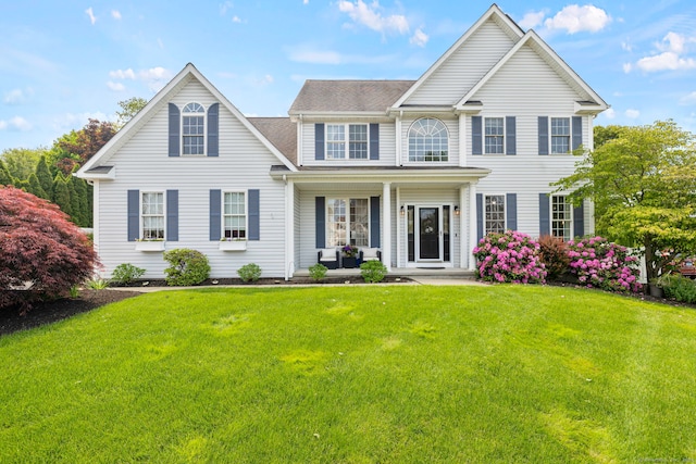 55 Perry Ln, Stratford, CT 06614 - colonial house with covered porch, a front lawn, and roof with shingles