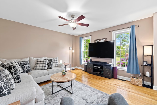55 Perry Ln, Stratford, CT 06614 - living room featuring a ceiling fan, wood finished floors, and baseboards