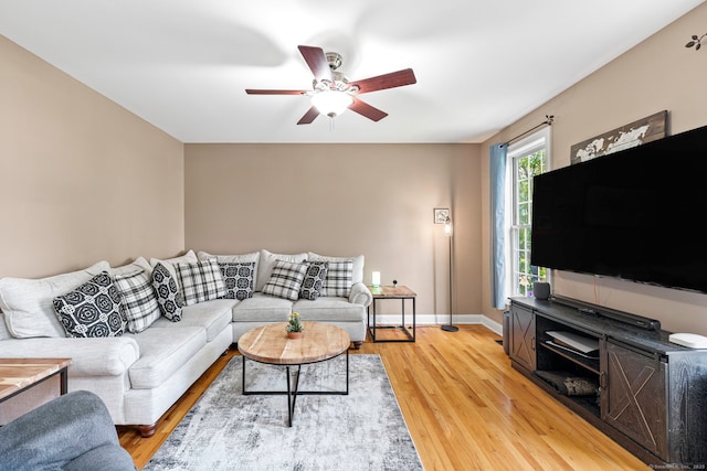 55 Perry Ln, Stratford, CT 06614 - living room featuring ceiling fan, light wood finished floors, and baseboards
