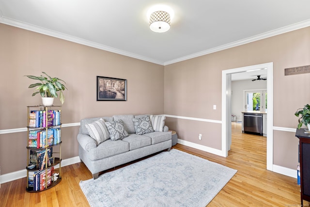 55 Perry Ln, Stratford, CT 06614 - living area with light wood finished floors, crown molding, and baseboards