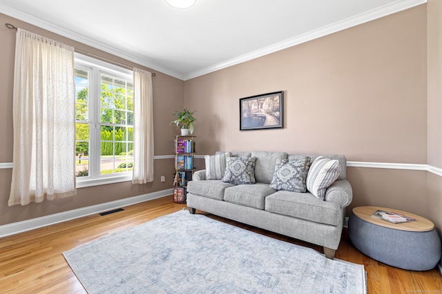 55 Perry Ln, Stratford, CT 06614 - living room featuring wood finished floors, baseboards, and ornamental molding