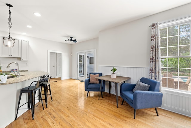 55 Perry Ln, Stratford, CT 06614 - living area with light wood-style flooring, recessed lighting, and wainscoting